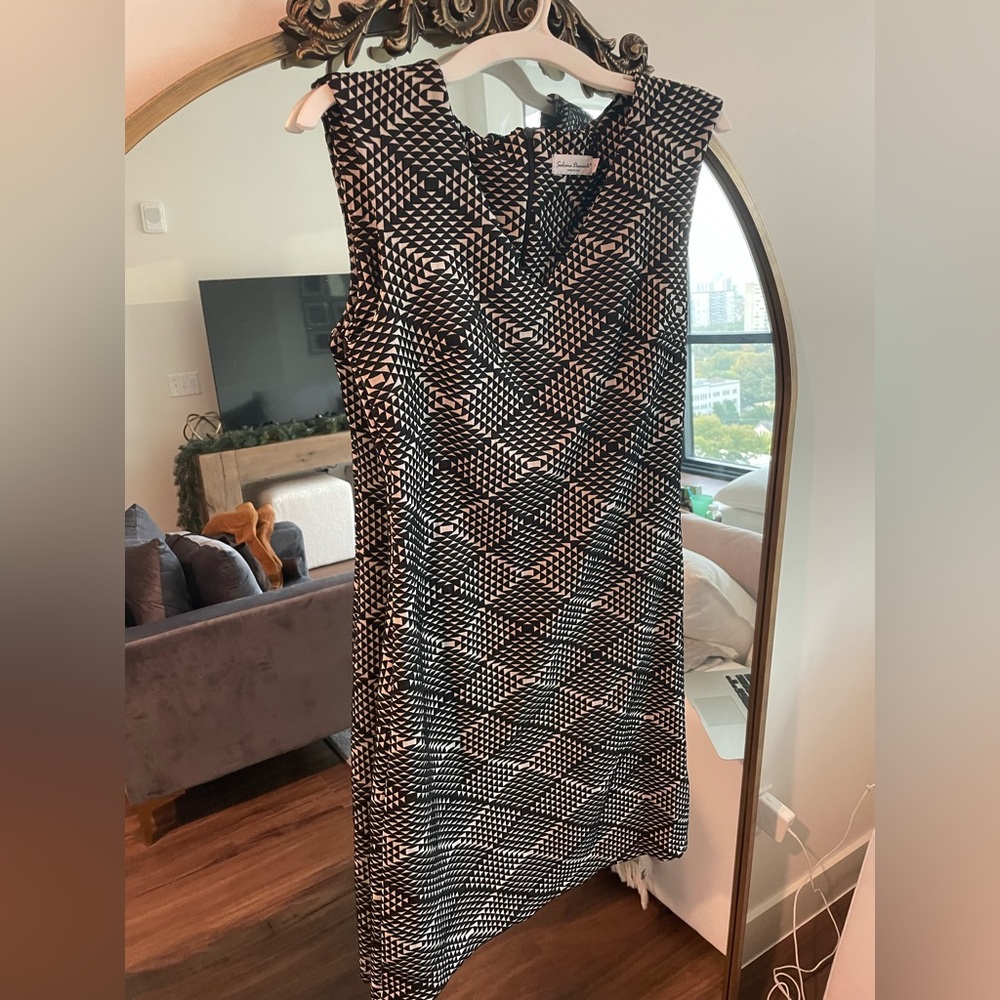 Cute black and cream holiday or work dress. Size small. Stretchy material